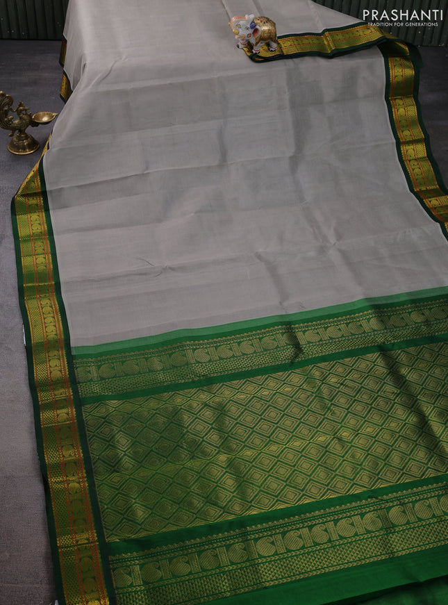 Silk cotton saree grey and green with plain body and zari woven korvai border