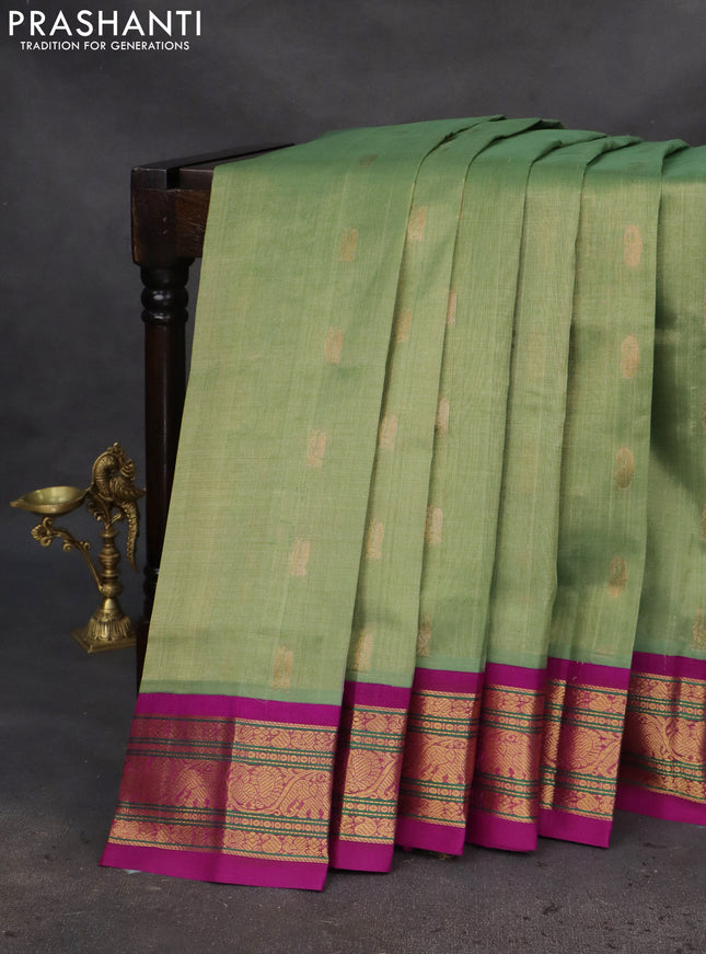 Silk cotton saree pastel green and purple with zari woven buttas and zari woven korvai border