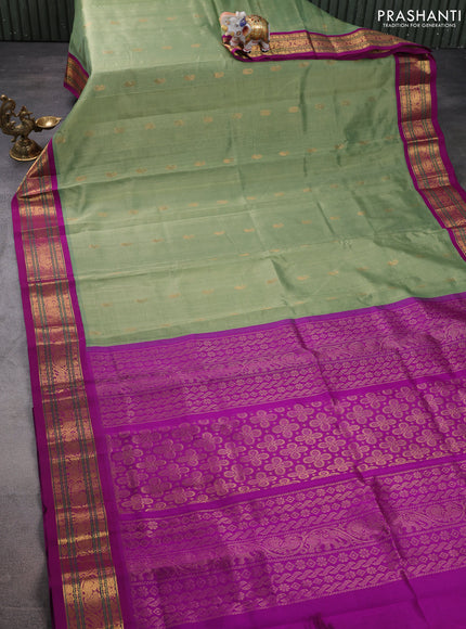 Silk cotton saree pastel green and purple with zari woven buttas and zari woven korvai border