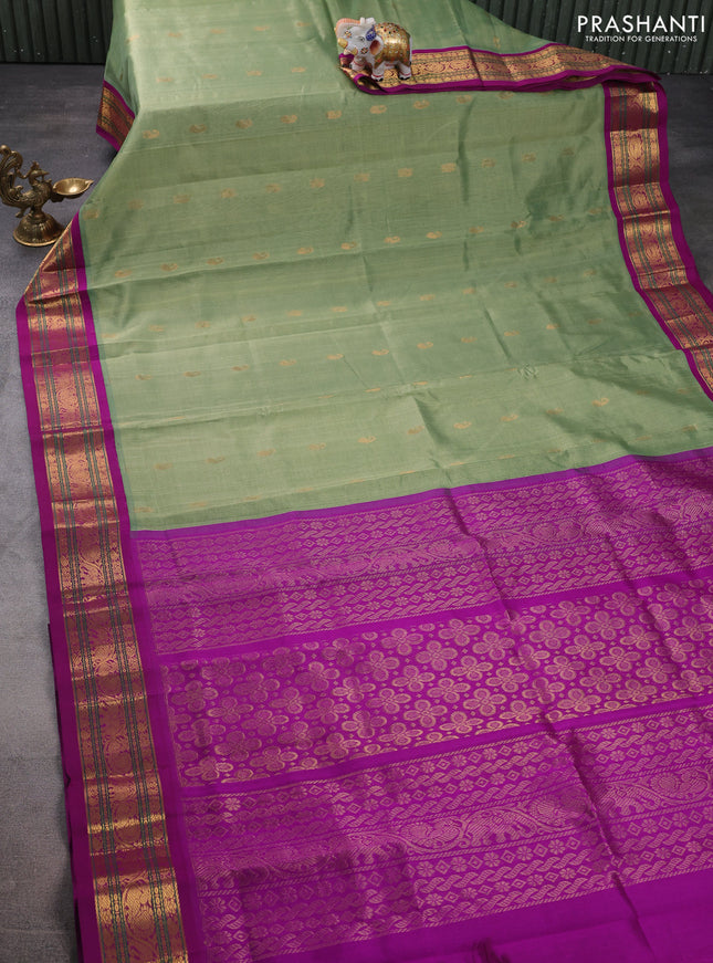 Silk cotton saree pastel green and purple with zari woven buttas and zari woven korvai border