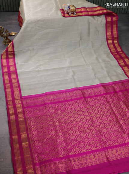 Silk cotton saree beige and magenta pink with plain body and rettapet zari woven korvai border