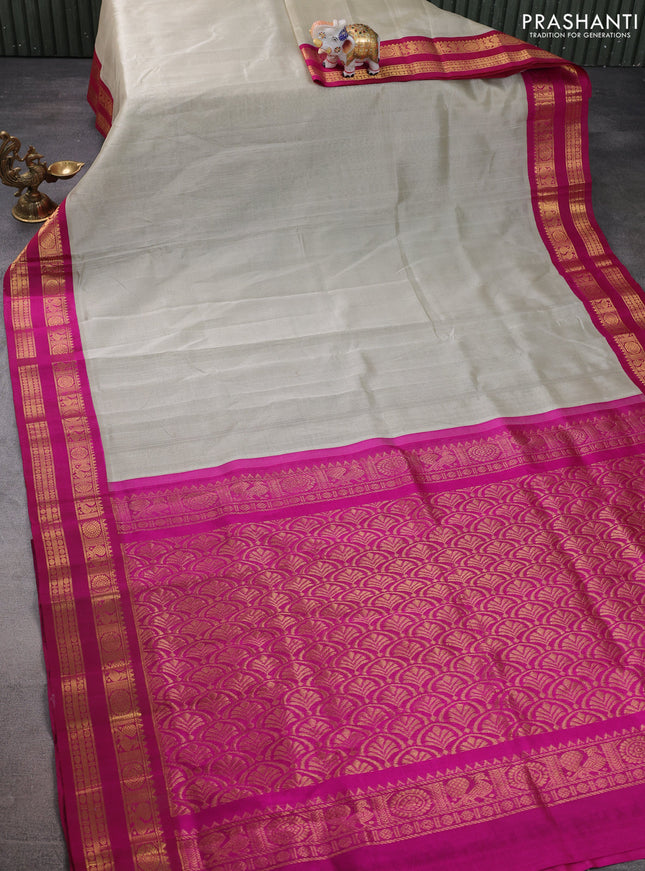 Silk cotton saree beige and magenta pink with plain body and rettapet zari woven korvai border