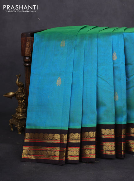 Silk cotton saree dual shade of teal bluish green and coffee brown with zari woven buttas and zari woven korvai border