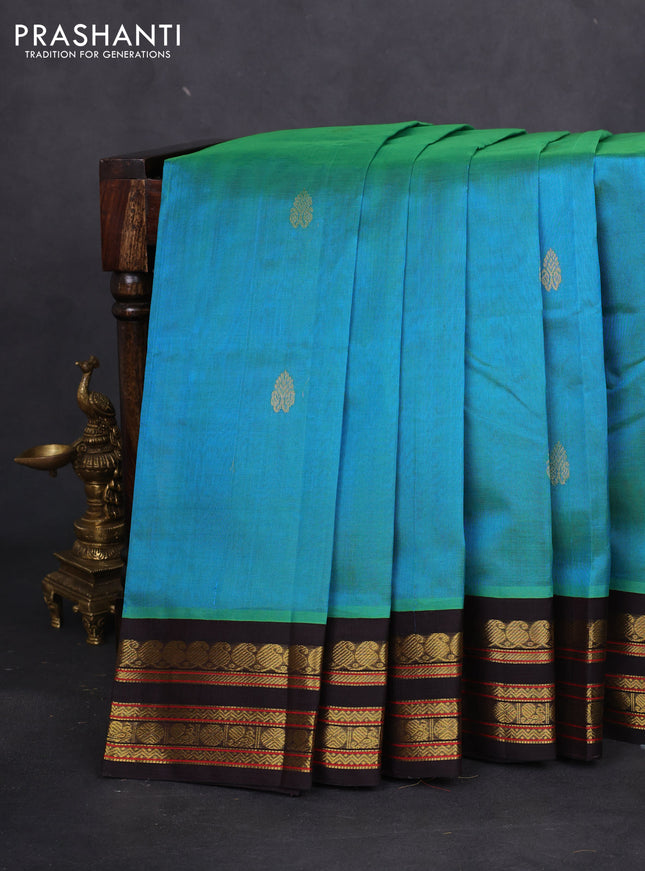 Silk cotton saree dual shade of teal bluish green and coffee brown with zari woven buttas and zari woven korvai border