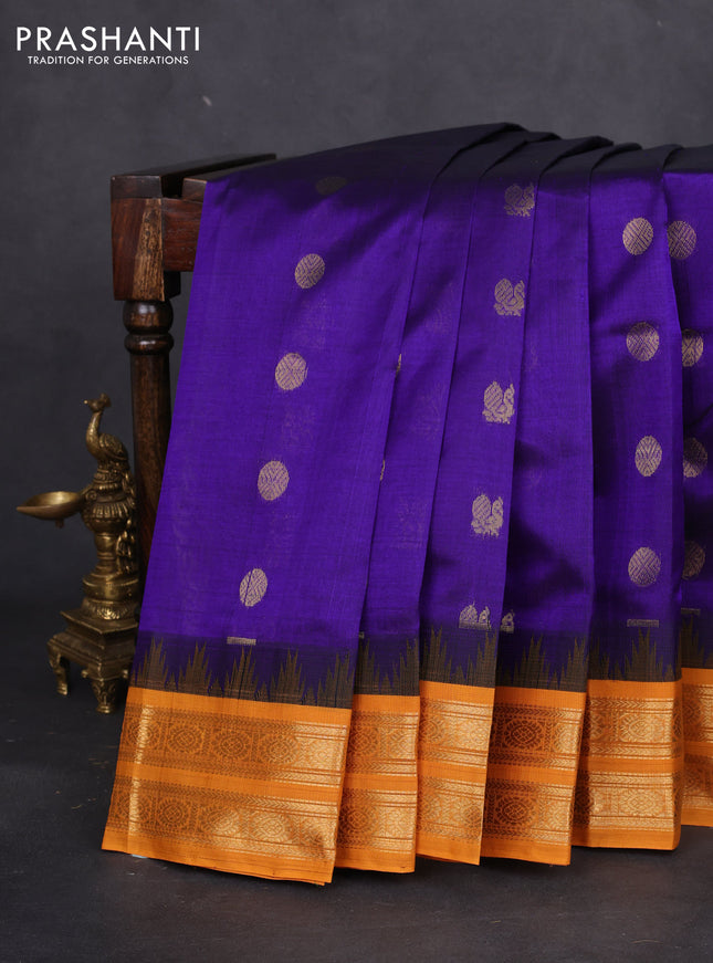 Silk cotton saree blue and mustard yellow with annam & rushraksha zari woven buttas and temple design zari woven korvai border