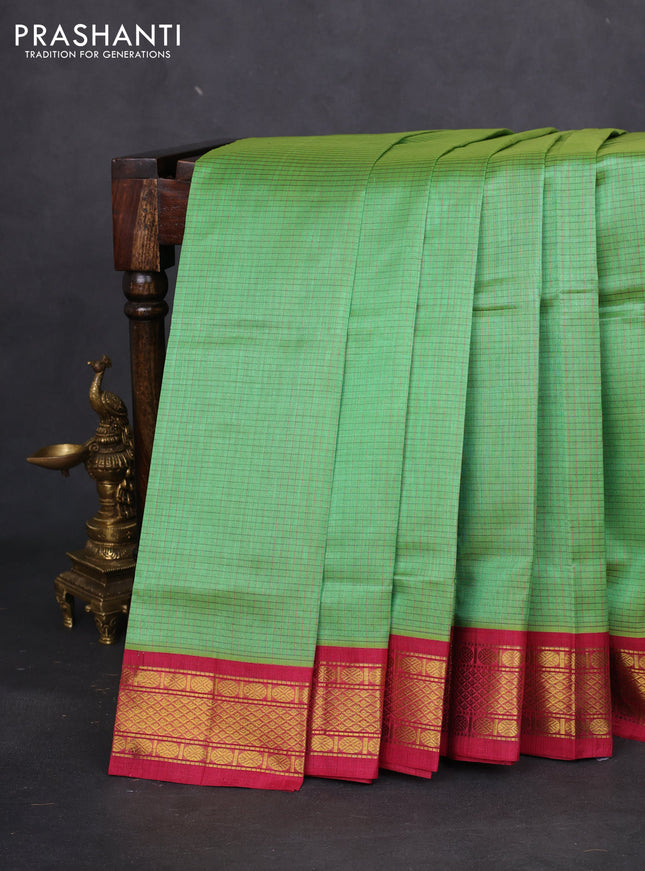 Silk cotton saree green and pink with allover thread checked pattern and zari woven korvai border