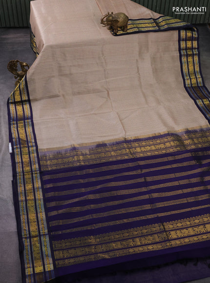 Silk cotton saree beifge and navy blue with allover thread checked pattern and zari woven korvai border