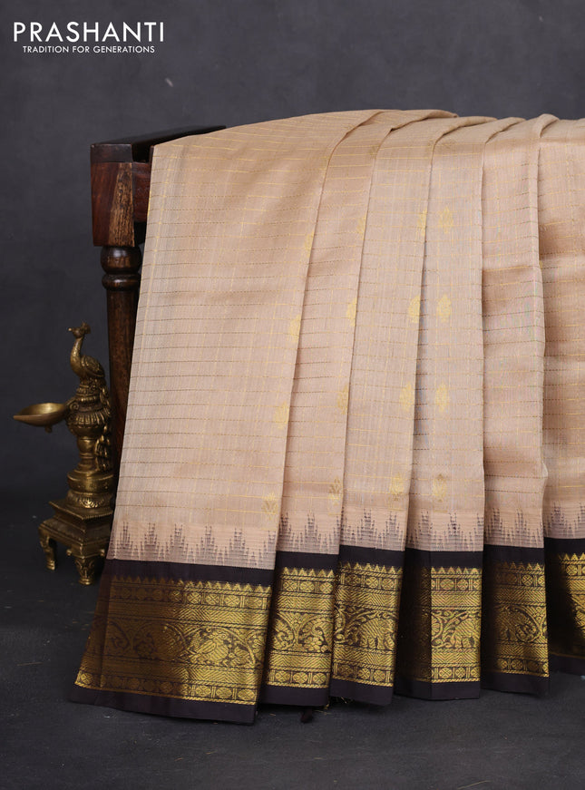 Silk cotton saree beifge and coffee brown with allover zari checks & buttas and temple design zari woven korvai border