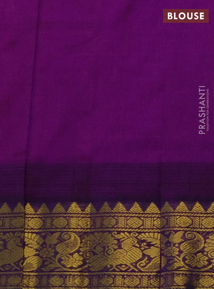 Silk cotton saree peach shade and purple with allover zari checks & buttas and temple design zari woven korvai border