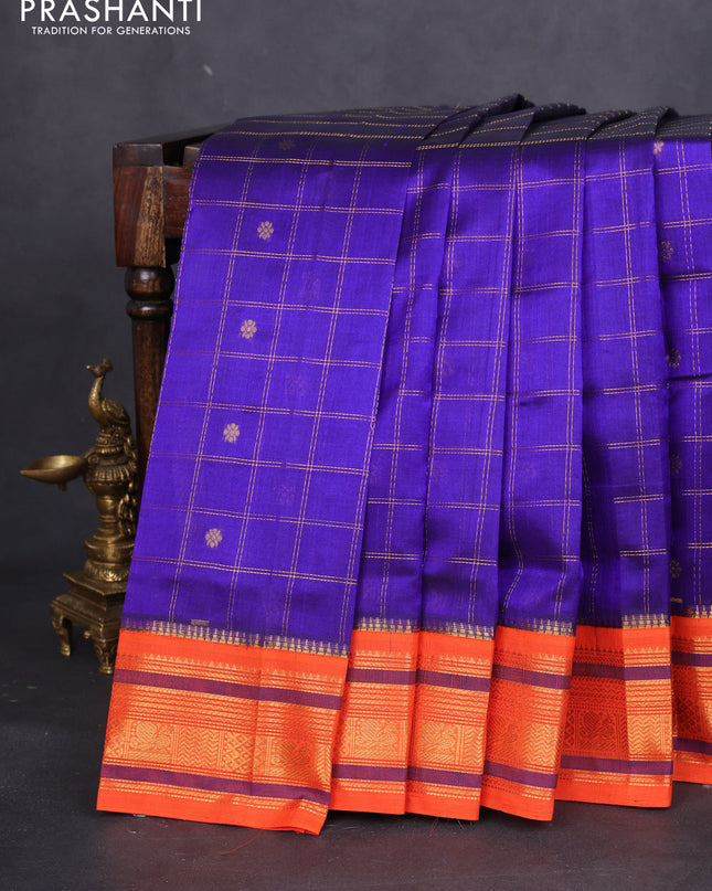 Silk cotton saree blue and orange with allover zari checks & buttas and zari woven korvai border
