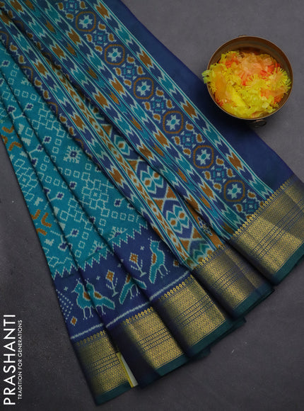 Semi tussar saree teal blue and dual shade of blue with allover ikat prints and zari woven border