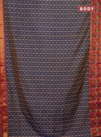 Semi tussar saree dual shade of bluish grey and pink with allover ikat prints and zari woven ikat border