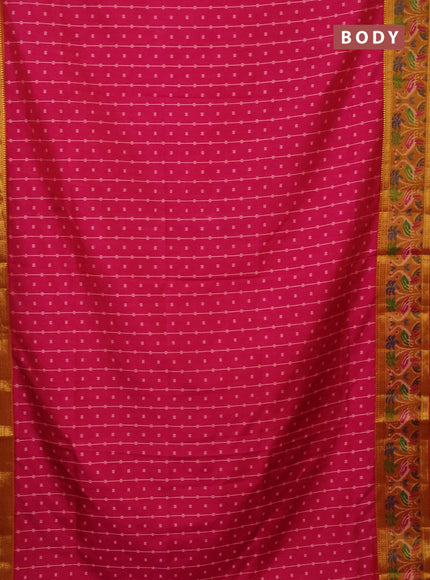 Semi tussar saree pink and dark mustard with allover ikat prints and zari woven ikat border