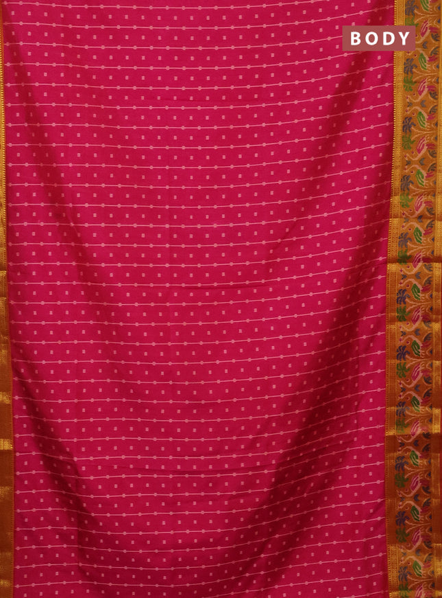 Semi tussar saree pink and dark mustard with allover ikat prints and zari woven ikat border
