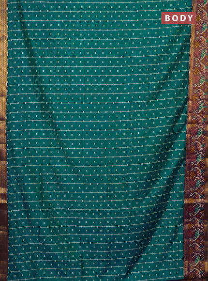 Semi tussar saree teal bluish green and purple with allover ikat prints and zari woven ikat border