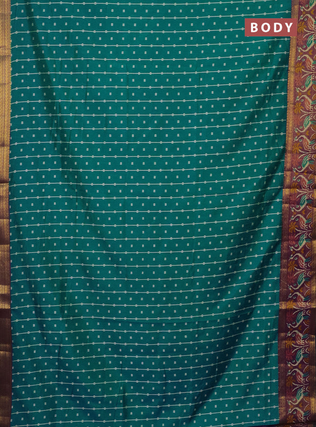 Semi tussar saree teal bluish green and purple with allover ikat prints and zari woven ikat border