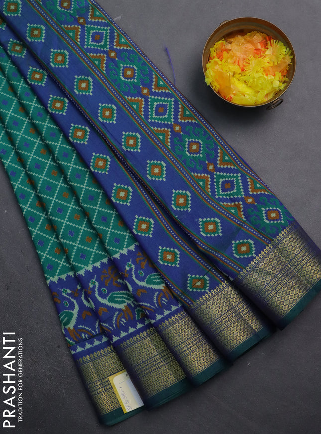 Semi tussar saree teal green and blue with allover ikat prints and zari woven border
