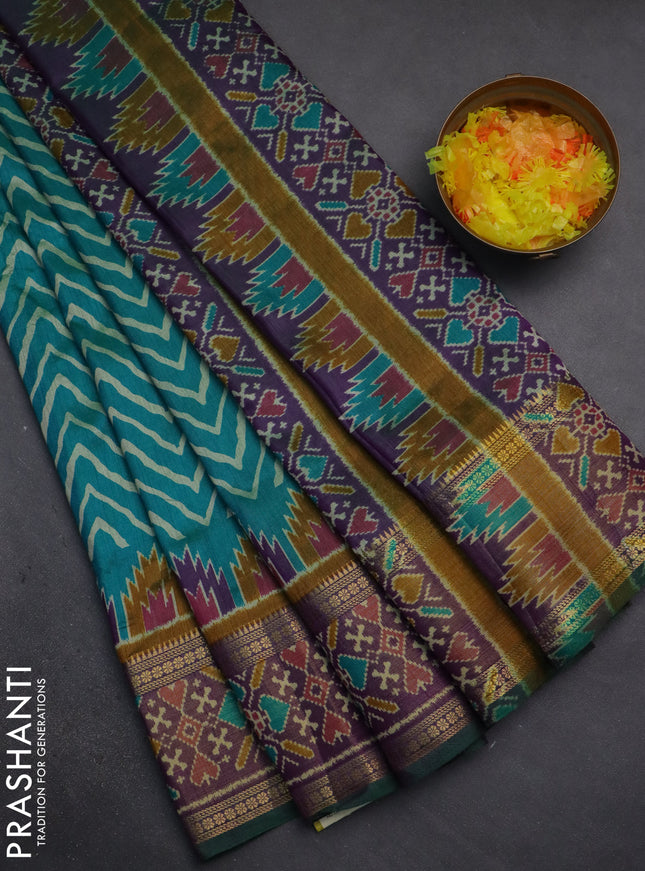 Semi tussar saree teal green and purple with allover zig zag prints and zari woven ikat border