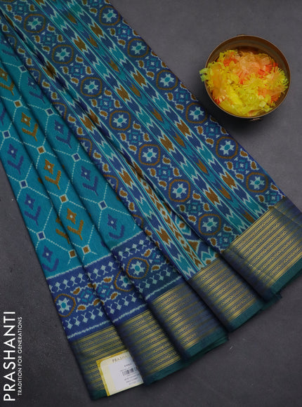Semi tussar saree teal bluish green and dual shade of blue with allover ikat prints and zari woven border
