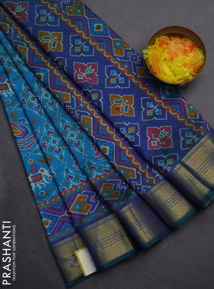 Semi tussar saree dual shade of teal bluish green and dual shade of blue with allover ikat prints and zari woven border
