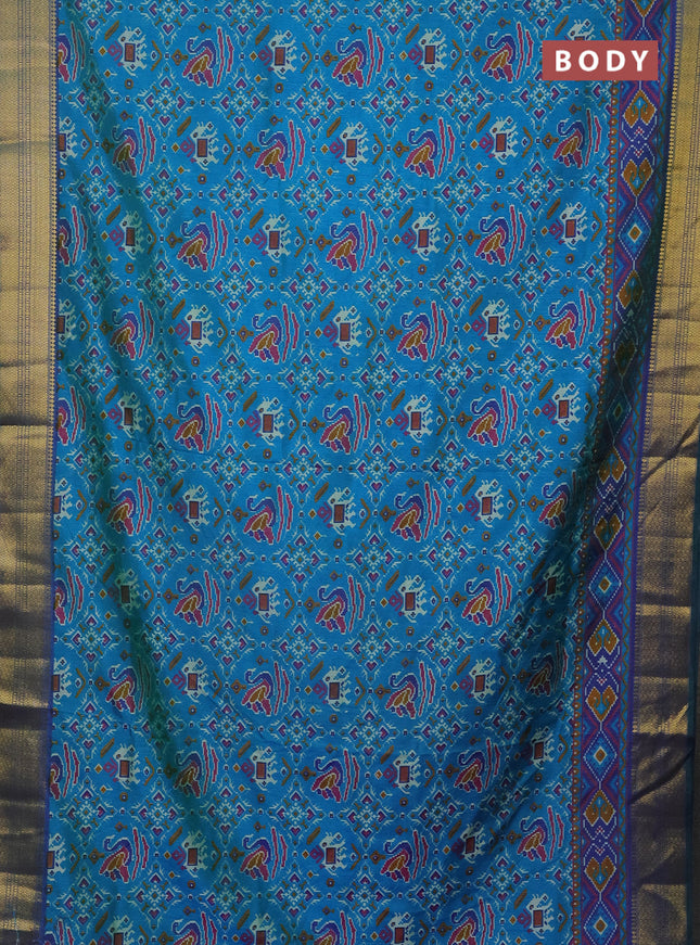 Semi tussar saree dual shade of teal bluish green and dual shade of blue with allover ikat prints and zari woven border