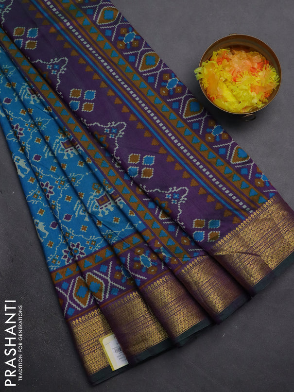 Semi tussar saree cs blue and purple with allover patola prints and zari woven border