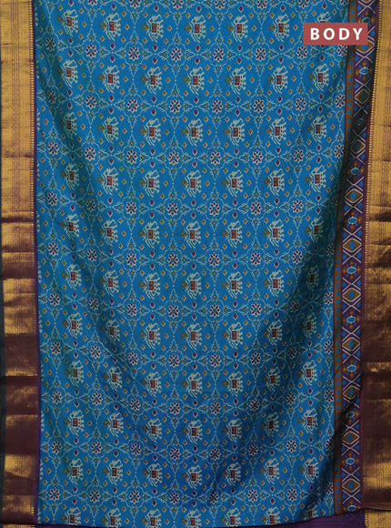 Semi tussar saree cs blue and purple with allover patola prints and zari woven border