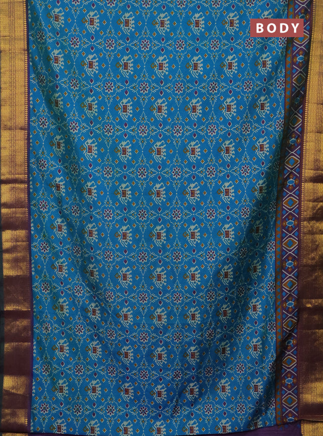 Semi tussar saree cs blue and purple with allover patola prints and zari woven border