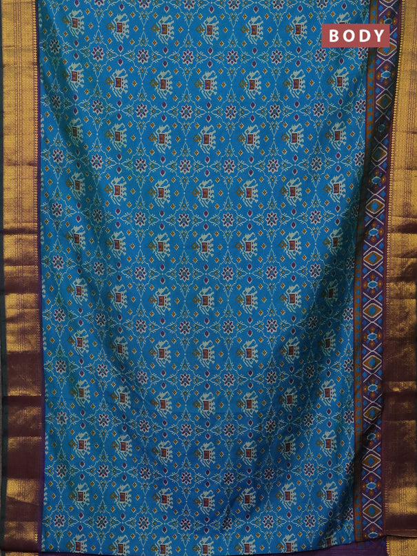 Semi tussar saree cs blue and purple with allover patola prints and zari woven border