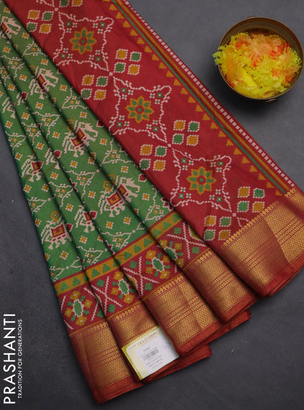 Semi tussar saree dual shade of green and dual shade of rust with allover patola prints and zari woven border