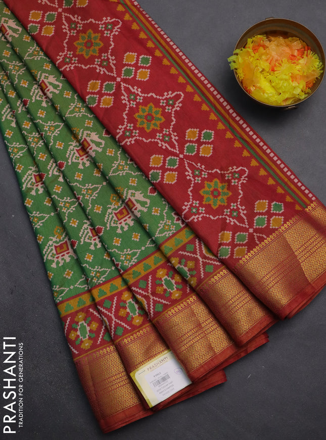 Semi tussar saree dual shade of green and dual shade of rust with allover patola prints and zari woven border