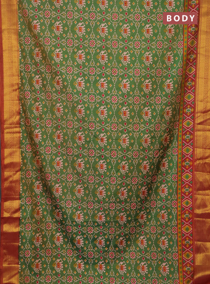 Semi tussar saree dual shade of green and dual shade of rust with allover patola prints and zari woven border