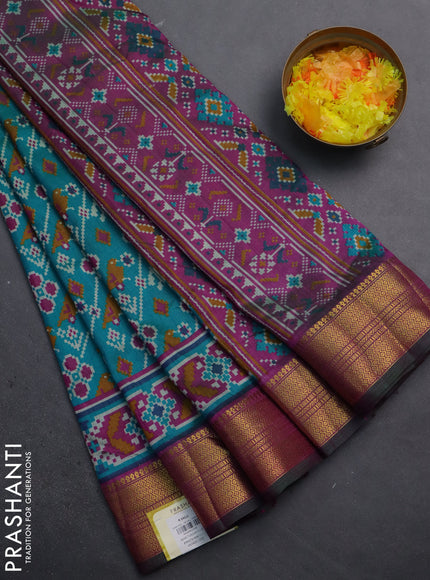 Semi tussar saree teal blue and purple with allover patola prints and zari woven border