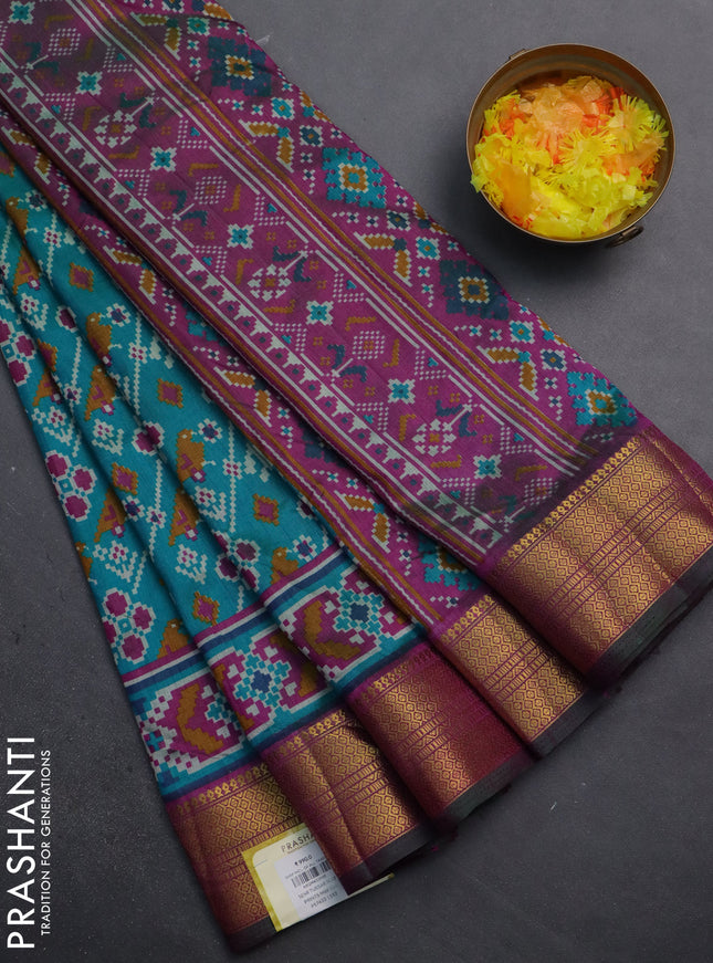 Semi tussar saree teal blue and purple with allover patola prints and zari woven border