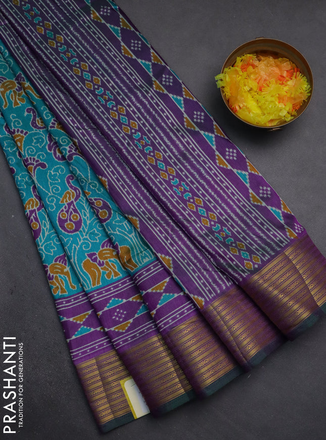 Semi tussar saree teal green and purple with allover ikat prints and zari woven border