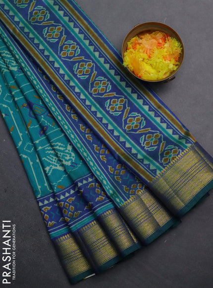 Semi tussar saree teal green and dual shade of blue with allover ikat prints and zari woven border