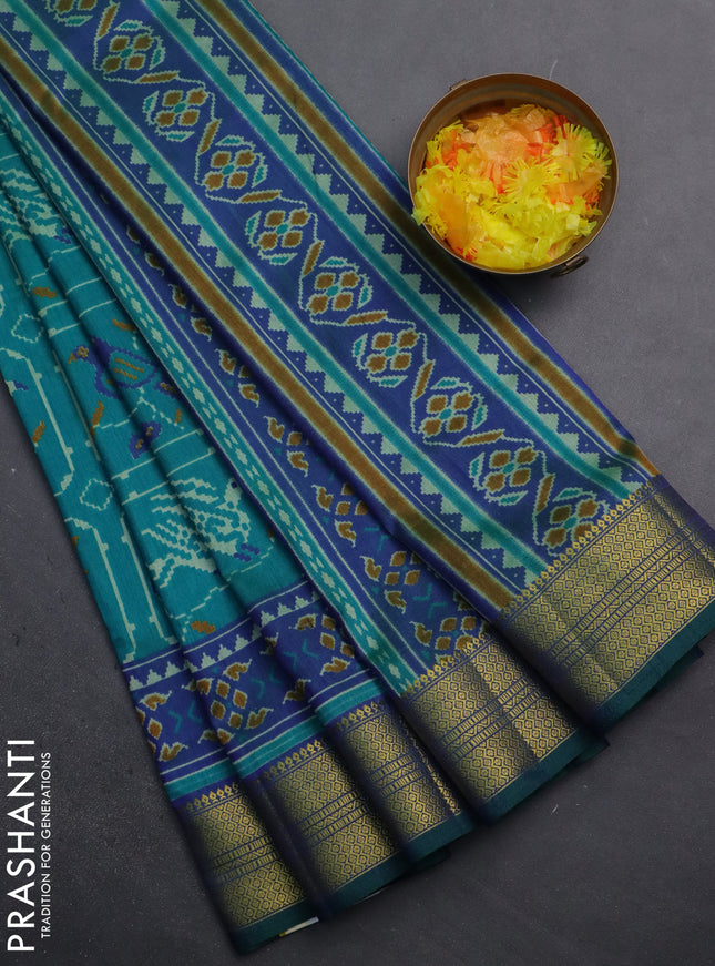 Semi tussar saree teal green and dual shade of blue with allover ikat prints and zari woven border
