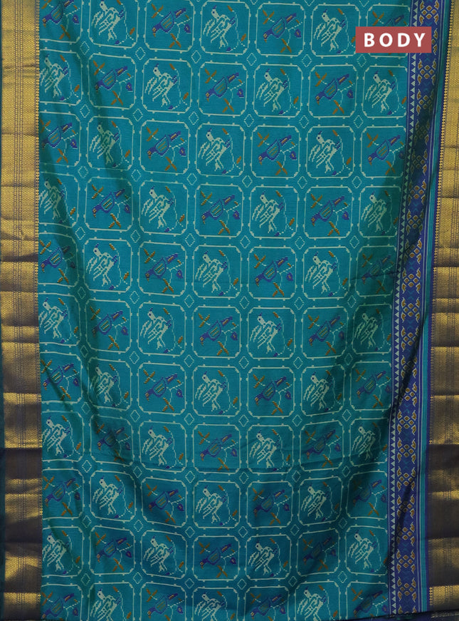 Semi tussar saree teal green and dual shade of blue with allover ikat prints and zari woven border