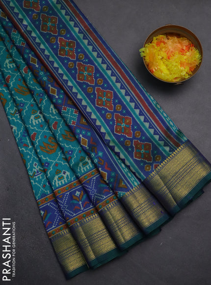 Semi tussar saree teal green and dual shade of blue with allover patola prints and zari woven border