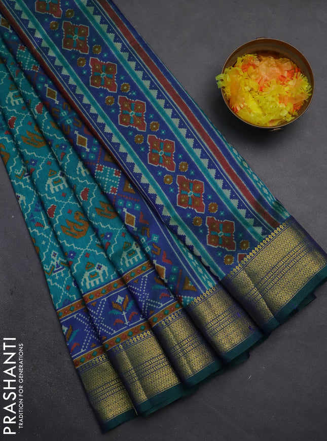 Semi tussar saree teal green and dual shade of blue with allover patola prints and zari woven border