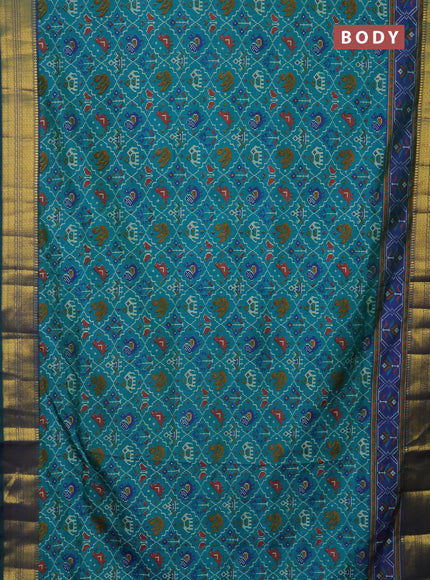 Semi tussar saree teal green and dual shade of blue with allover patola prints and zari woven border