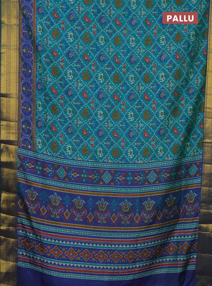 Semi tussar saree teal green and dual shade of blue with allover patola prints and zari woven border