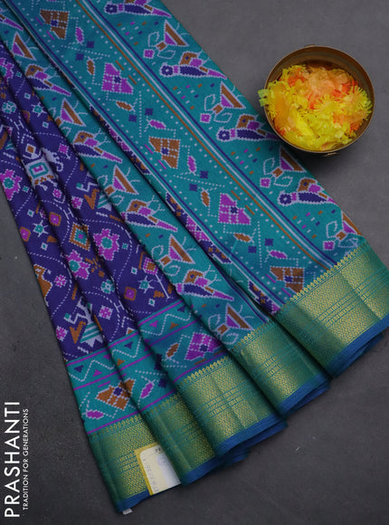 Semi tussar saree dark blue and teal green with allover patola prints and zari woven border