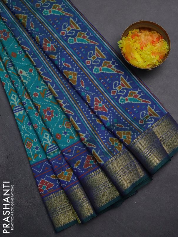 Semi tussar saree teal bluish green and dual shade of violet with allover patola prints and zari woven border