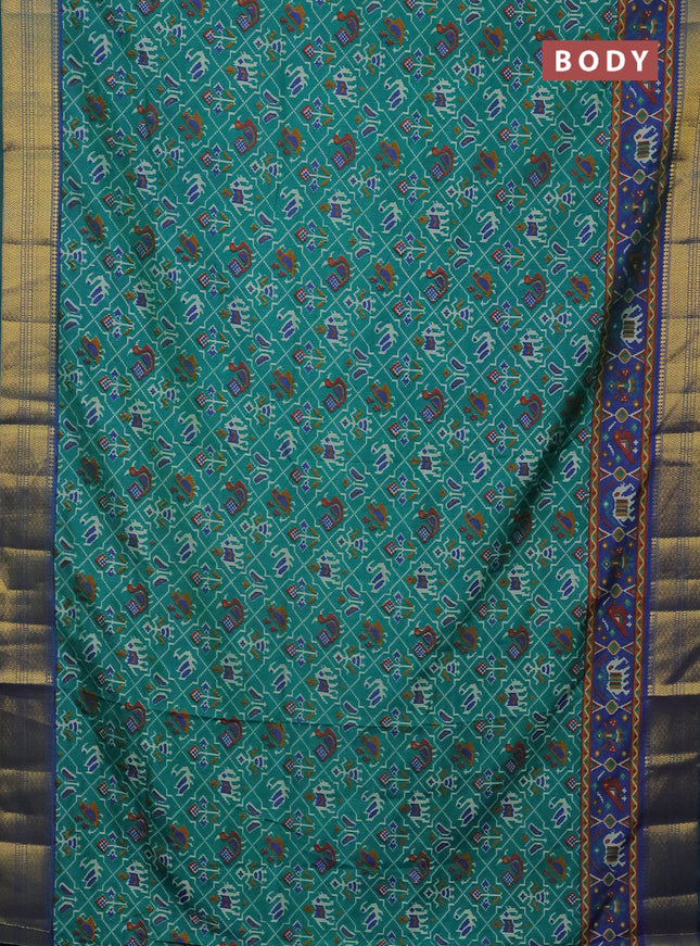 Semi tussar saree teal green and dual shade of blue with allover patola prints and zari woven border