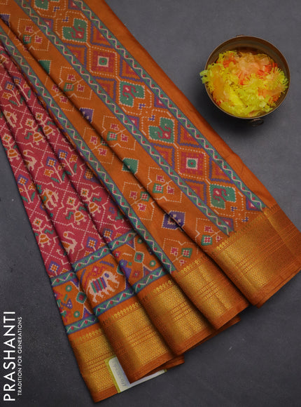 Semi tussar saree dual shade of pink and dark mustard with allover patola prints and zari woven border