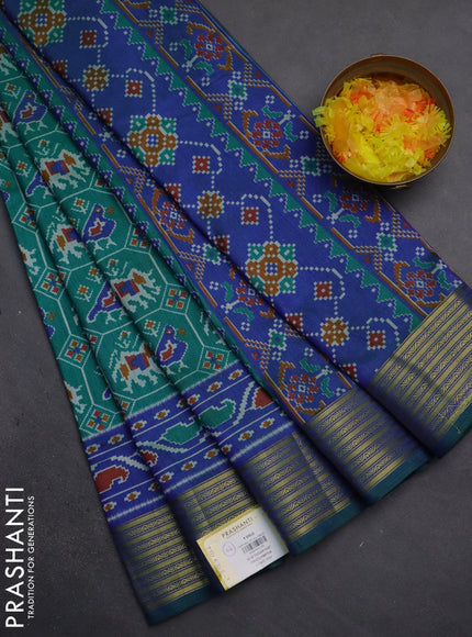 Semi tussar saree teal green and blue with allover patola prints and zari woven border