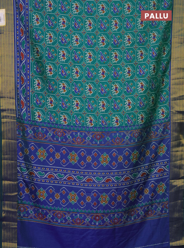 Semi tussar saree teal green and blue with allover patola prints and zari woven border