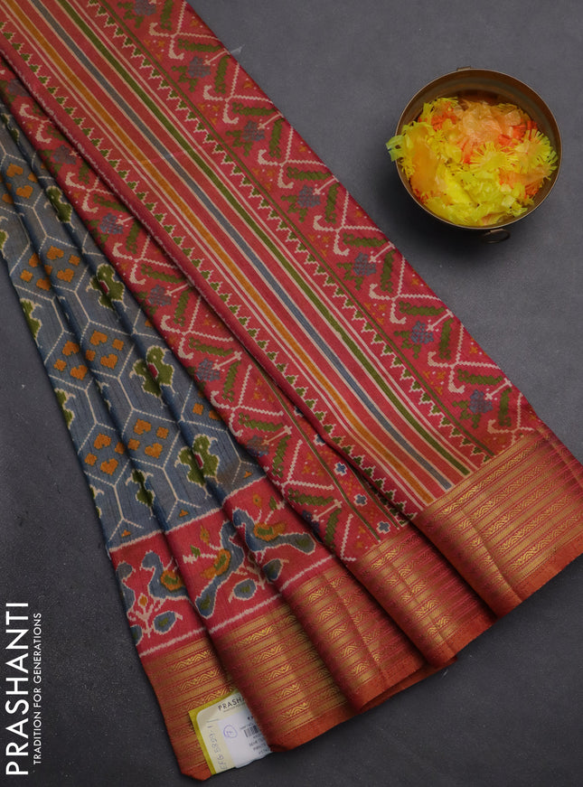 Semi tussar saree dual shade of bluish grey and rust shade with allover patola prints and zari woven border