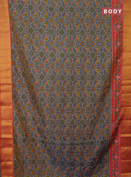 Semi tussar saree dual shade of bluish grey and rust shade with allover patola prints and zari woven border